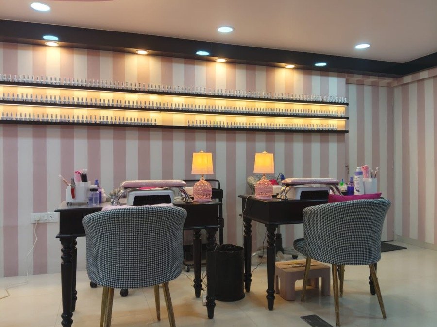 The SoBo nail bar with backlit polish wall and manicure stations