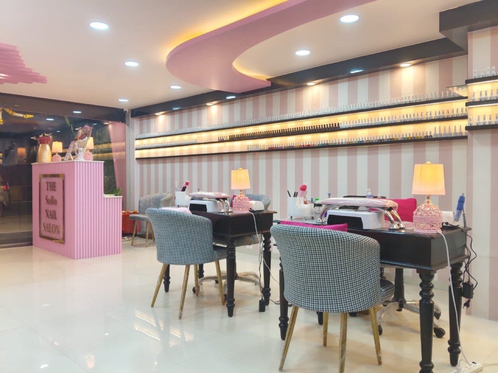 The SoBo Nail Salon interior on FC Road — pink-striped nail bar with reception desk